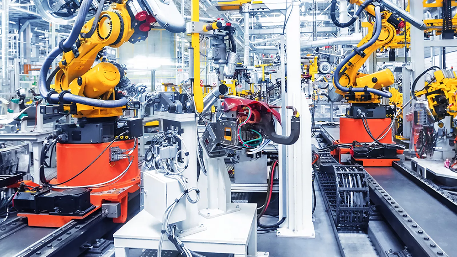 Yellow robots in industrial building