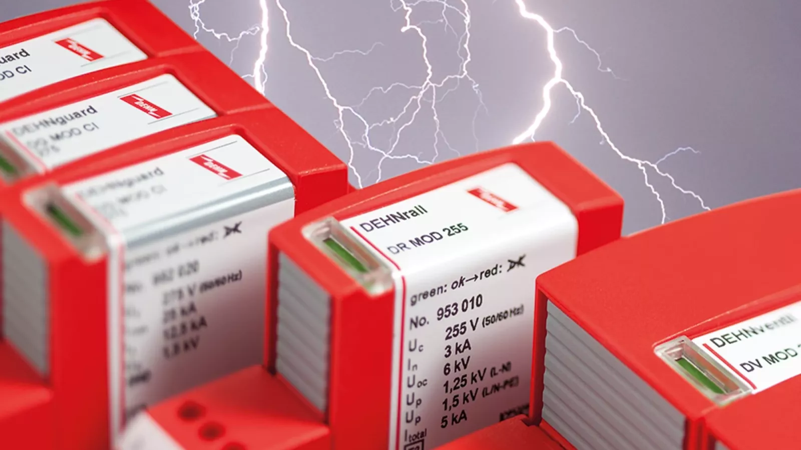 Red surge protection modules with labels and green status windows, set against a background with lightning bolts.