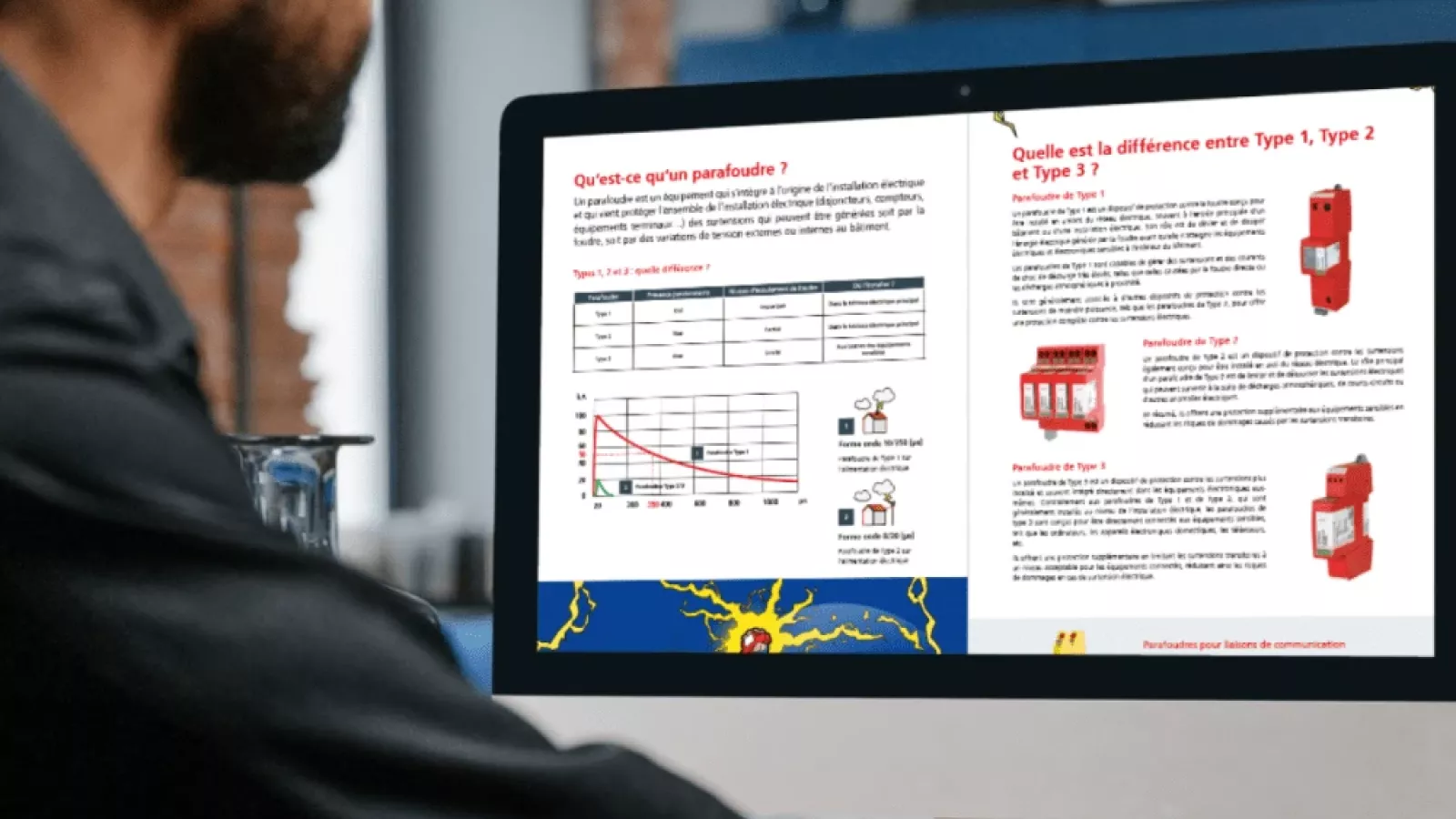 Man viewing guide about surge protection devices on computer screen showing Type 1, Type 2 and Type 3 explanations.