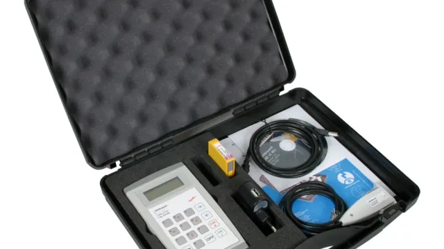 Portable measurement kit in a foam-lined case with a handheld device, cables, adapter, battery and software media.