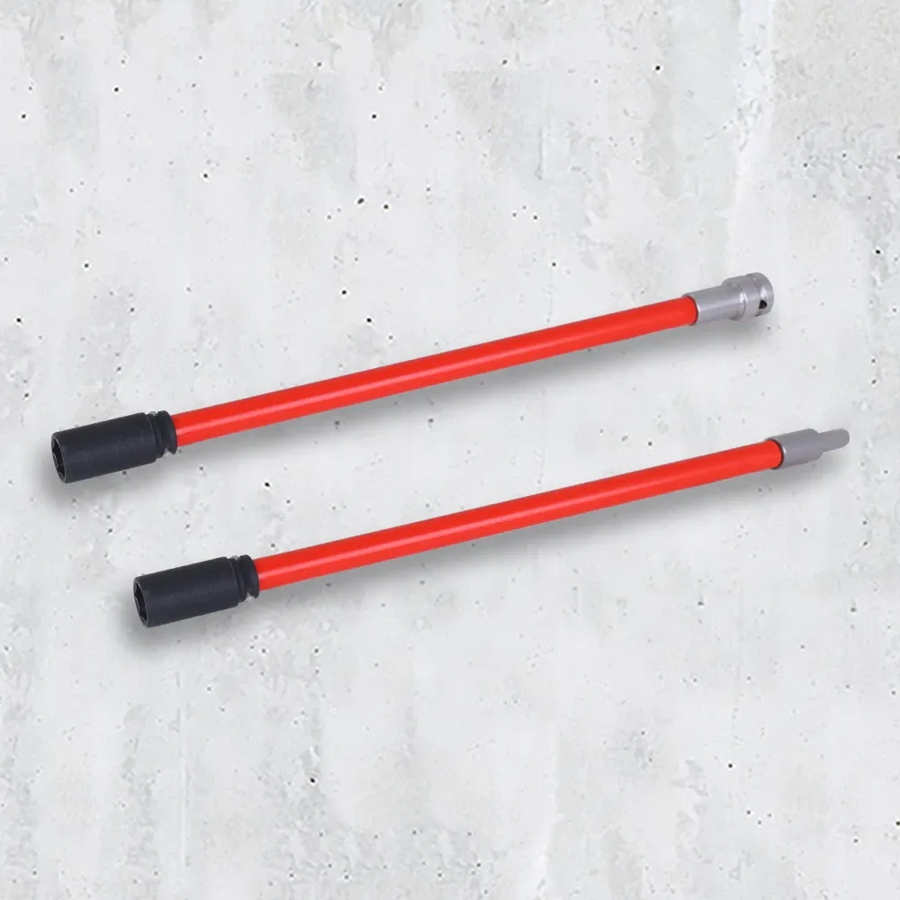 Deux outils de montage rouges avec des extrémités noires et argentées, sur une surface de béton gris clair.