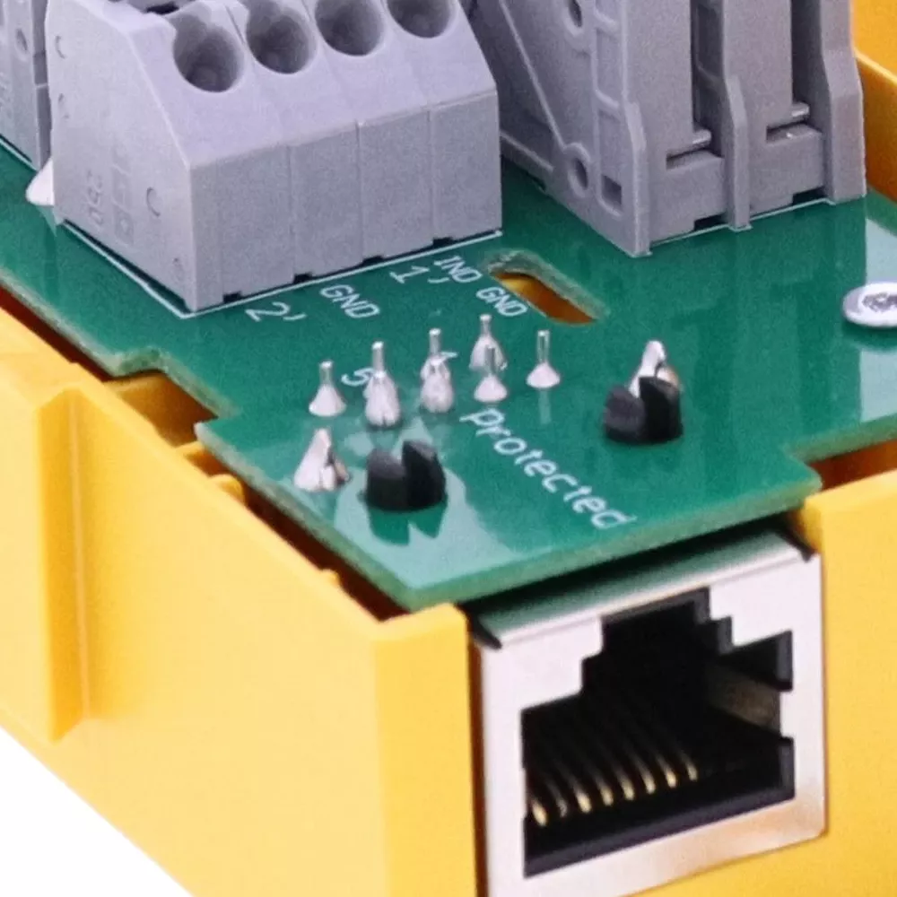 Close-up of terminal blocks and an RJ45 port on a DEHNbox circuit board.