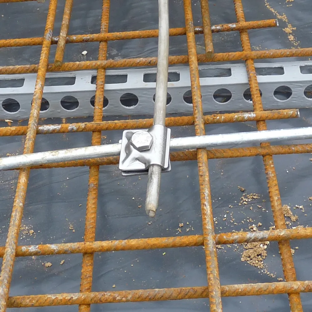 Foundation earthing clamp fixed to rebar grid in concrete slab for building lightning protection system