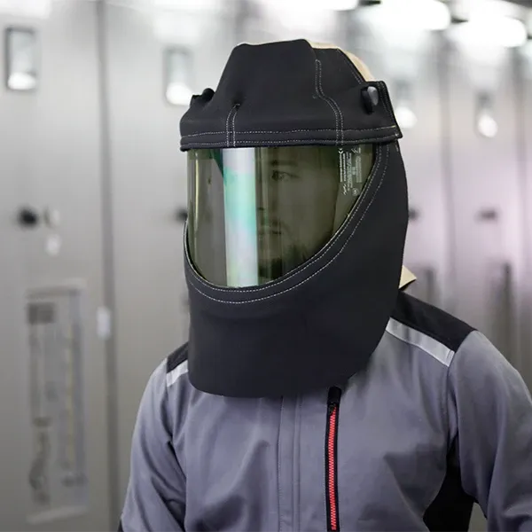 A man is wearing a protective hood.