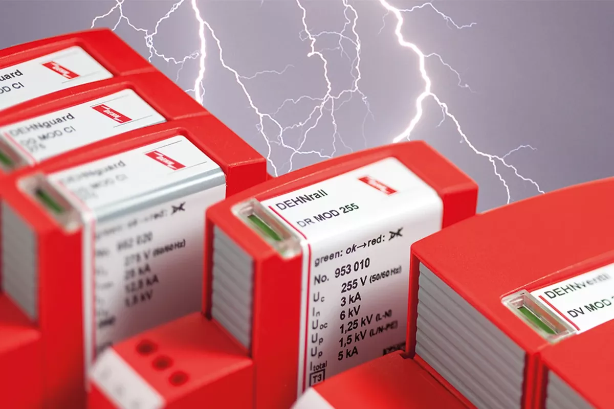 Red surge protection modules with labels and green status windows, set against a background with lightning bolts.