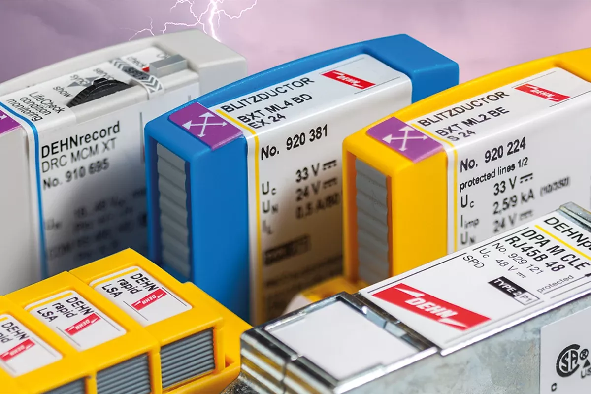 Close-up of colored surge protection modules with labels and status windows, set against a background with lightning.